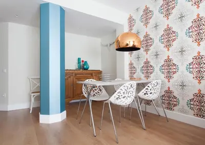 a dining room with a table and chairs at Passeig de Gracia Apartment in Barcelona