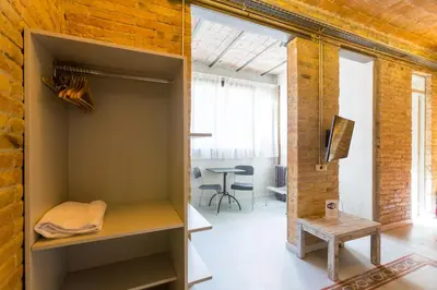 a room with a closet with a table in it at Apartamentos DV in Barcelona