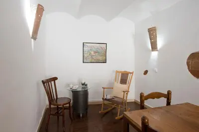a dining room with chairs and a table and a table at Apartments Mo in Monistrol