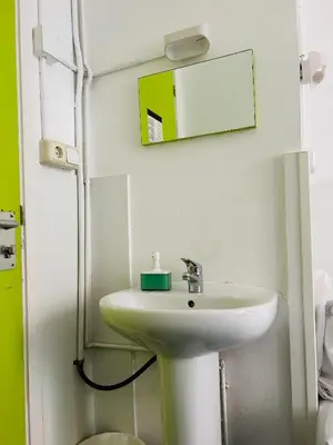 a bathroom with a sink and a mirror at Central and Basic Universitat for YOUNG HOSTEL in Barcelona