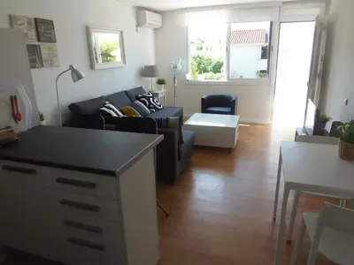 a living room with a couch and a table at Apartment Aloha Sitges in Sitges