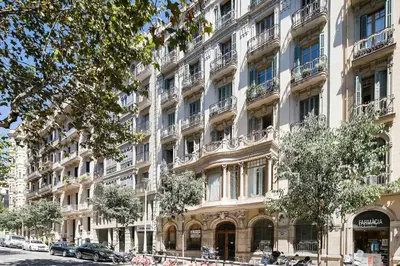 a large building with balconies on a city street at Habitat Apartments Barcelona Classic in Barcelona