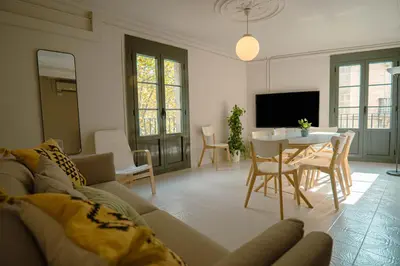 a living room with a couch and a table at Smartr Barcelona Ramblas in Barcelona