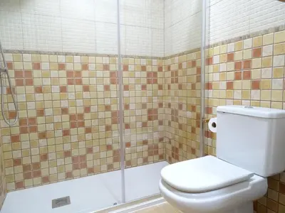 a bathroom with a toilet and a shower at Apartment Sant Sebastià in Sitges