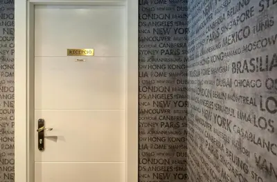 a white door in a room with writing on the wall at HOTEL SANT PERE ll HSPII in Rubí
