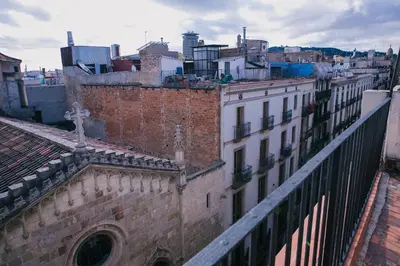 a view of a city from the roof of a building at Hostal Fernando in Barcelona