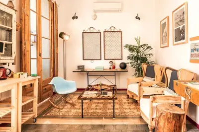 a living room with a couch and a table at Factory Suites Barcelona in Barcelona