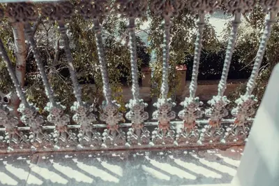 an ornate metal fence with a pool of water at Hotel Transit in Barcelona