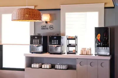 a kitchen with three microwaves on a counter at B&B HOTEL Barcelona Mollet in Mollet del Vallès