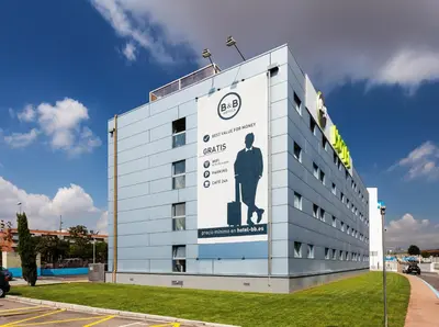 a building with a sign on the side of it at B&B HOTEL Barcelona Mollet in Mollet del Vallès