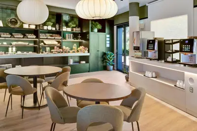 a store with two tables and chairs in a room at B&B HOTEL Barcelona Granollers in Les Franqueses del Vallès