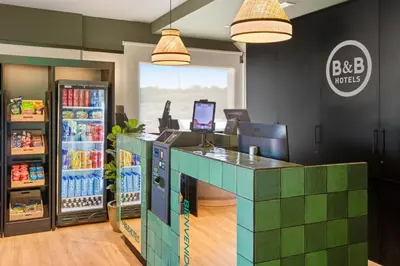 a soda shop with a green counter and a soda machine at B&B HOTEL Barcelona Granollers in Les Franqueses del Vallès