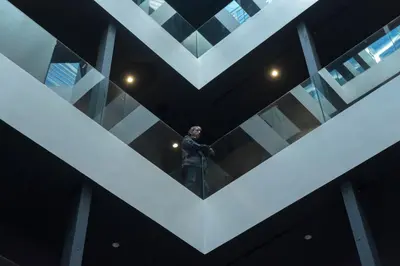 a statue of a man standing in the middle of a building at Chi in Barcelona
