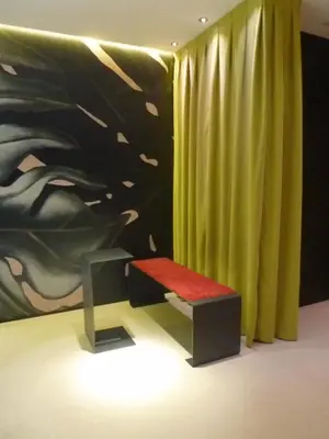 a room with a bench and a painting and a curtain at Barcelona House in Barcelona