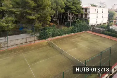 an overhead view of a tennis court at Blanco Vinyet in Sitges