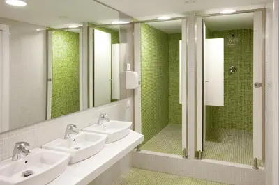 a bathroom with two sinks and a shower at Sant Jordi Hostels Sagrada Familia in Barcelona