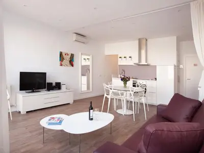 a living room with a couch and a table at Stay U-nique Apartments Sant Pau in Barcelona