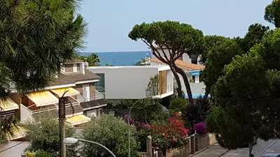 a view of a house with the ocean in the background at Castelldefels Playa in Castelldefels