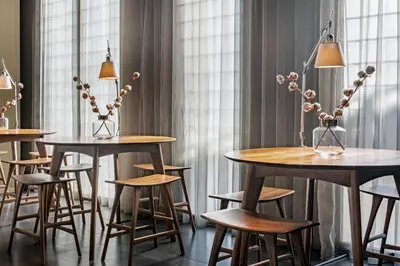 a hotel room with a bed and a table at AC Hotel Sants by Marriott in Barcelona