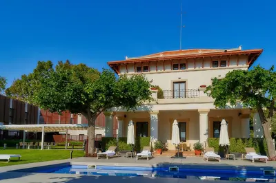 a building with a pool in front of it at Hotel Arrey Alella in Alella