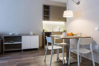 a kitchen with a table and chairs in a room at Flateli 430 BCN in Barcelona