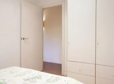 a bedroom with a bed and a closet at Authentic flat2 in Poble sec - Paralelo in Barcelona