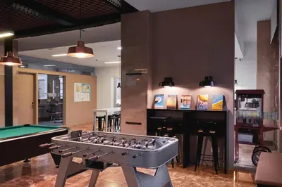 a room with a pool table and a bar at Residencia Universitaria Resa Barcelona Diagonal in Barcelona