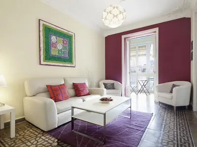 a living room with a white couch and a table at Apartment in Barcelona near Passeig de Gràcia in Barcelona
