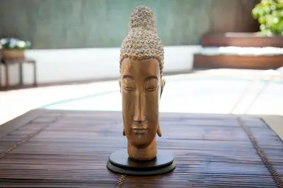 a statue of a head on a table at New Opening Villa Oasis Terramar in Sitges