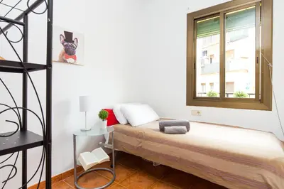 a bedroom with a bed and a window at Key Sagrada Familia - Carrer Del Clot in Barcelona