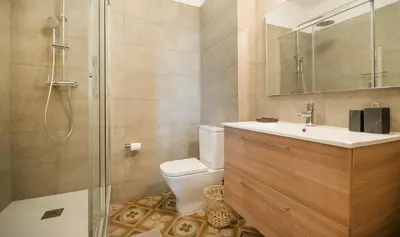 a bathroom with a toilet and a sink and a shower at You Stylish Boutique Apartments in Barcelona