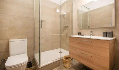 a bathroom with a shower and a toilet and a sink at You Stylish Boutique Apartments in Barcelona