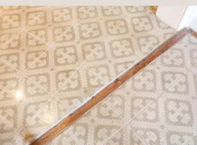 a wooden stick on the floor of a room at Napoles · Modernist flat close to Sagrada Familia in Barcelona
