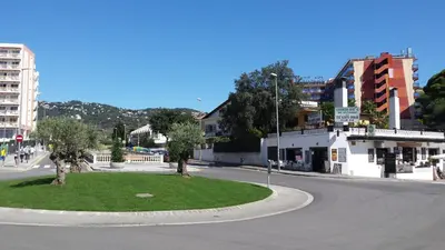 an empty street with a roundabout in a city at Apartaments Mar Blau Calella in Calella