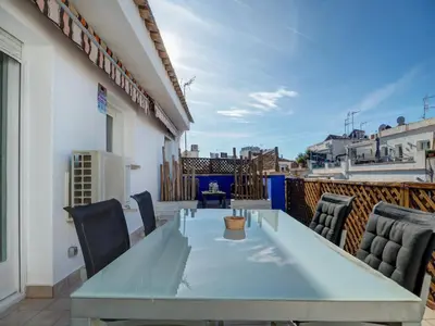 a patio with a table and chairs on a balcony at Amazing Terrace in the Center by Hello Homes Sitges in Sitges