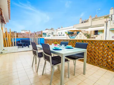 a table and chairs on the balcony of a house at Amazing Terrace in the Center by Hello Homes Sitges in Sitges