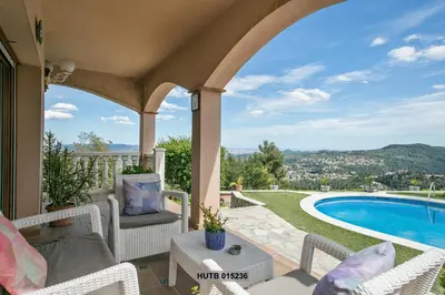a patio with chairs and a swimming pool at Alcam Can Macia in Corbera de Llobregat