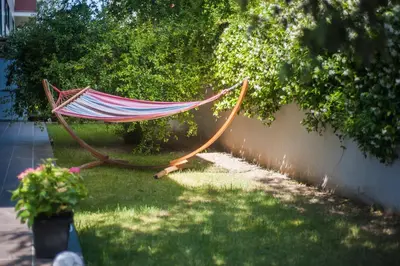a hammock in the grass in a yard at Luxury Apartment in Sitges City in Sitges
