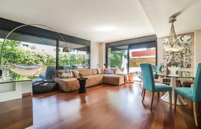 a living room with a couch and a table at Luxury Apartment in Sitges City in Sitges