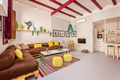 a living room with a couch and a table at Sweett - Raco in Barcelona