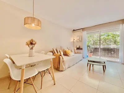 a living room with a couch and a table at Casa Natura Barcelona Fira & Camp Nou Stadium in Hospitalet de Llobregat
