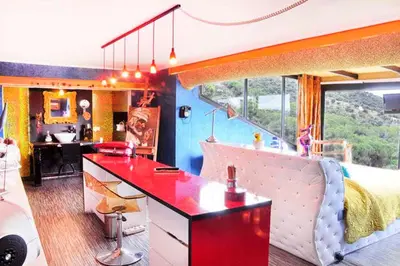 a kitchen with a red counter top in a room at Casa Miramiranda in Teià