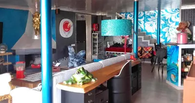 a living room with a couch and a table at Casa Miramiranda in Teià