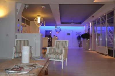 a living room with two chairs and a table at Solvi Hotel - Adults Only in Vilanova i la Geltrú