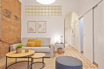 a living room with a couch and a table at Citytrip Palau de la Música in Barcelona