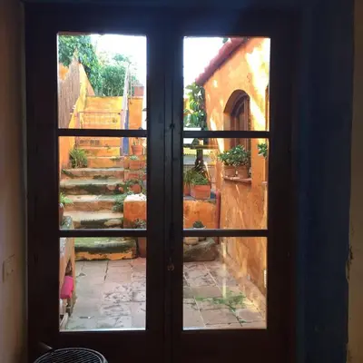 an open door with a view of a stairway at El Terral in Sant Vicenç de Montalt