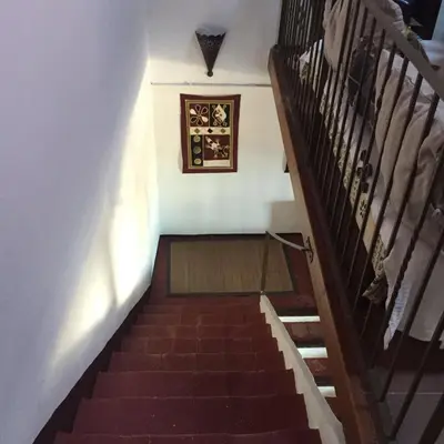 a set of stairs with a picture on the wall at El Terral in Sant Vicenç de Montalt