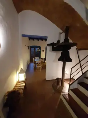 a room with a table and a light in a building at El Terral in Sant Vicenç de Montalt