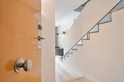 a staircase in a house with a door at Inside Barcelona Apartments Princep in Barcelona