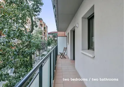 a balcony of a building with a chair at Inside Barcelona Apartments Princep in Barcelona